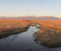 Zapata Ranch with Cattle and Bison by American Round-Up